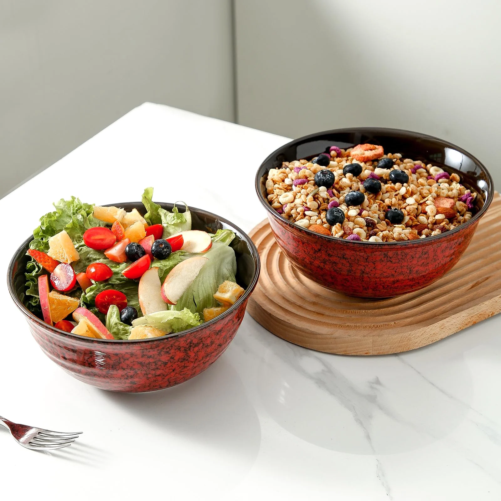A serving bowl and a salad bowl, one glaze family